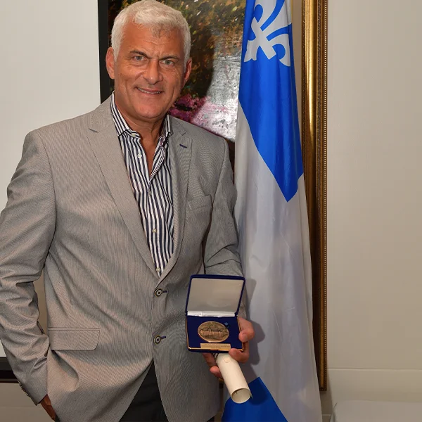 Man in suit with medal. Importance of this recognition.